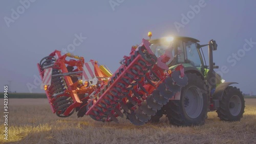 tractor making tillage in field and agricultural machinery
