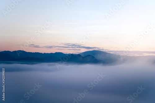 Yun Rai misty mountain foggy sunrise view point. © dodotone