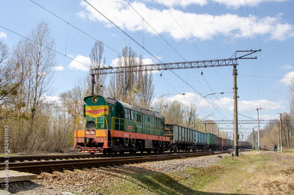 Green freight train travels by rail Green freight train travels by rail