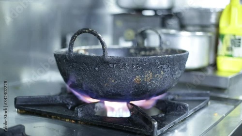 Hot pan on gas stove preparing for cooking  at the restaurant. 