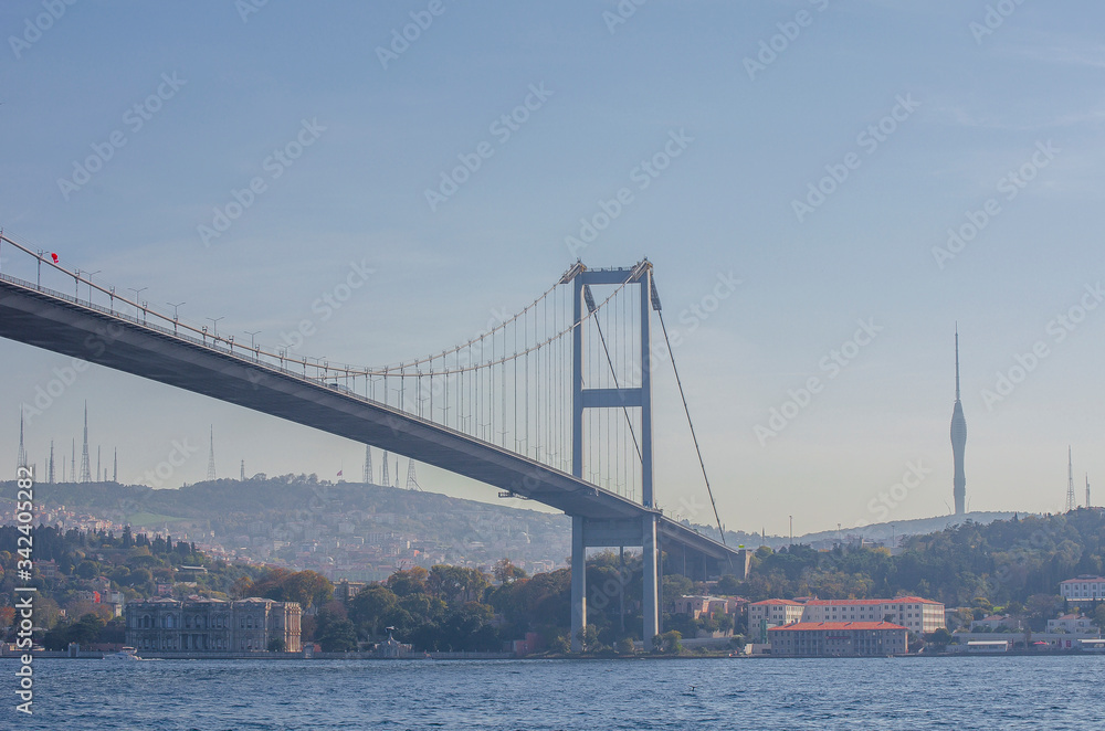 15 July Martyrs Bridge, Bosphorus bridge. famous bridge over  Bosphorus Strait on sunny day against blue sky. popular tourist destination. Selective focus. Turkey, Istanbu