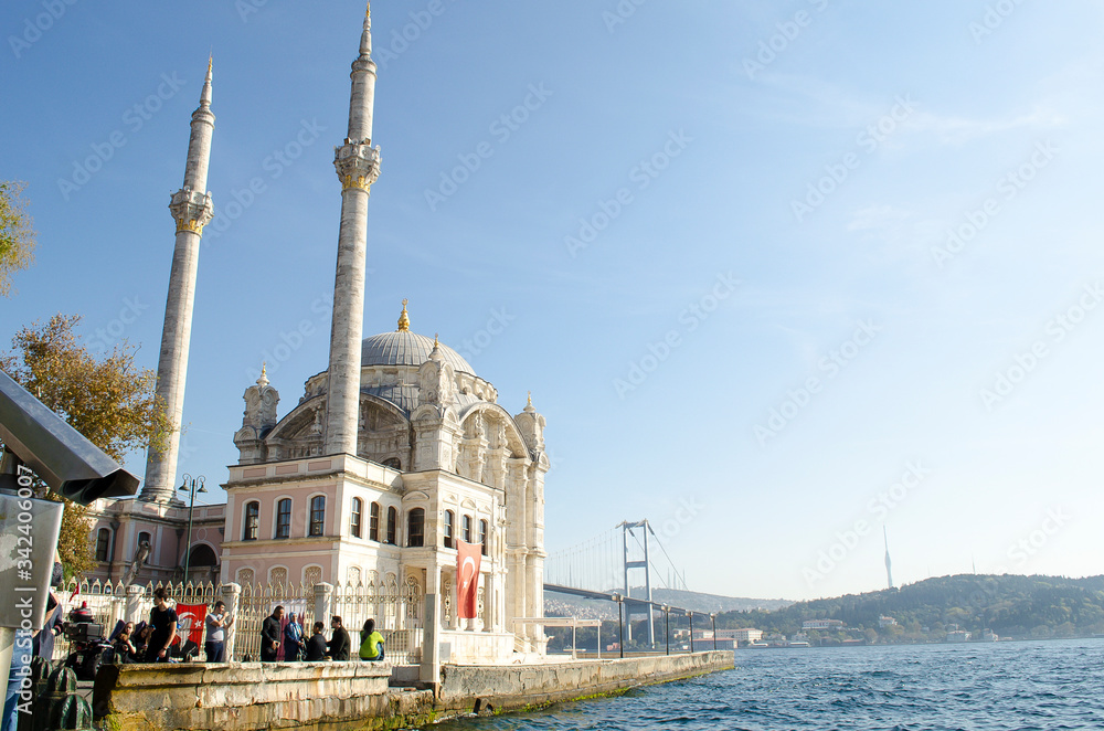 Bosphorus Bridge and Ortakoy Mosque against blue sky, situated at the waterside of Ortakoy pier square, one of the most popular locations on Bosphorus. Turkey, Istanbul, Besiktas