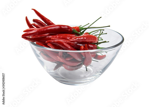 glass cup with pods of red hot pepper isolated on a white background
