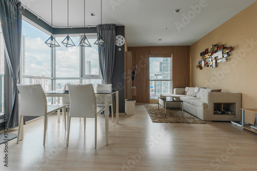 Beautiful and large living room interior with hardwood floors and vaulted ceiling in new luxury home.