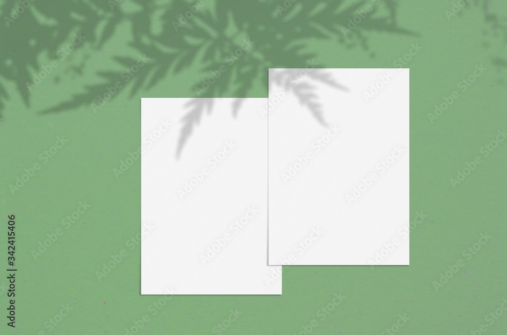 Blank white vertical paper sheet 5x7 inches with shadow overlay. Modern and stylish greeting card or wedding invitation mock up. Blank white vertical paper sheet 5x7 inches with shadow overlay. Modern and stylish greeting card or wedding invitation mock up.