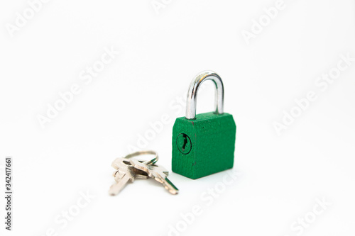 small lock with a key on a white background