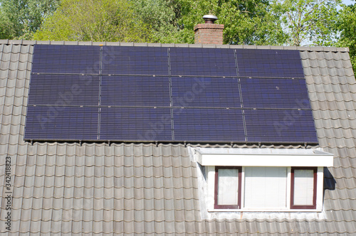 Solar panels on a large black roof for electric power generation
