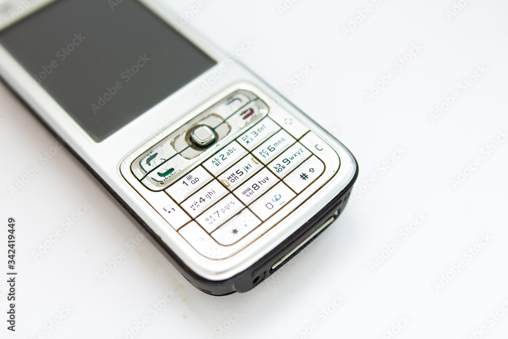 old push-button smartphone on a white background old push-button smartphone on a white background