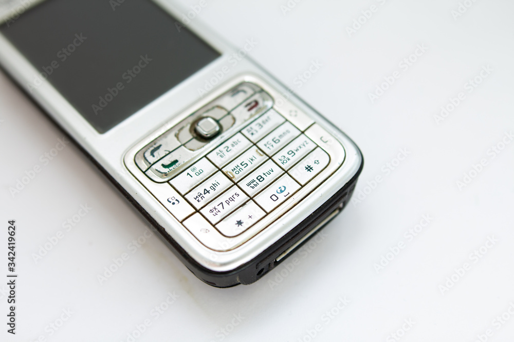 old push-button smartphone on a white background old push-button smartphone on a white background