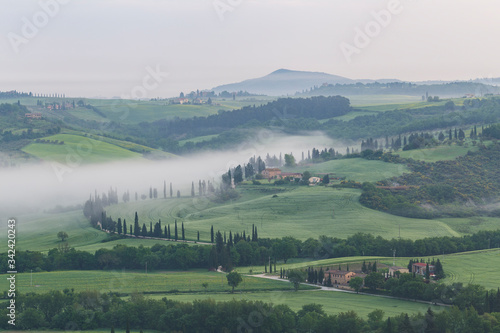 Early morning mist on the Val d'Orcia in Tuscany, Italy.