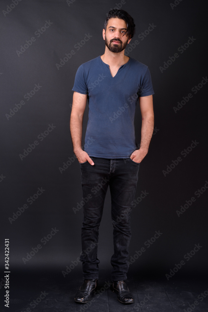 Full body shot of handsome bearded Persian man Full body shot of handsome bearded Persian man