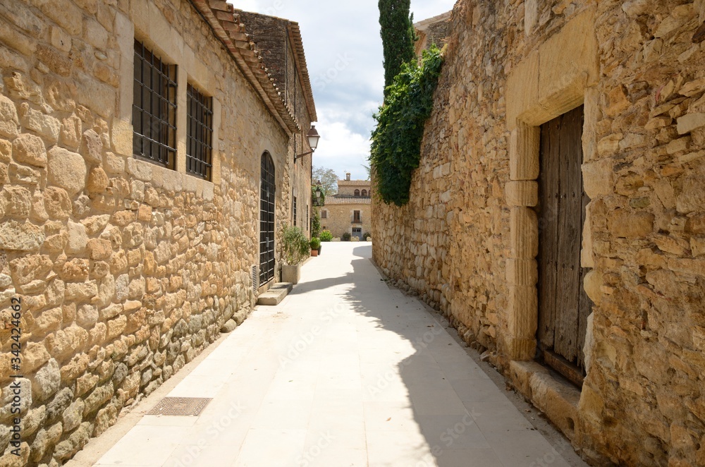 Stone alley in Girona village, Spain