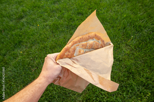 Hand holding Ramadan Pita ( Ramazan Pidesi ) photo