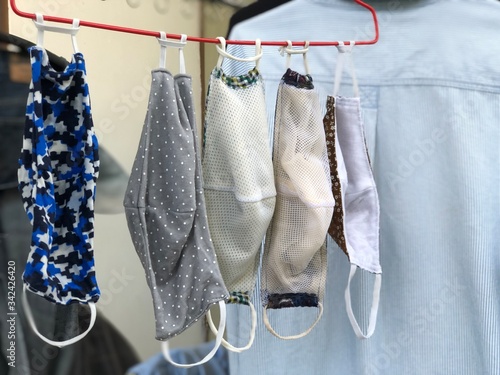 Cotton cloth mask hanging outdoor after the used and washing,natural glare light,the mask repeated use 2-3 times,after use every day should wash and dry in the sun to be sterilized as well,coronavirus