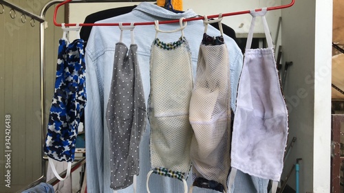 Cotton cloth mask hanging outdoor after the used and washing,natural glare light,the mask repeated use 2-3 times,after use every day should wash and dry in the sun to be sterilized as well,coronavirus