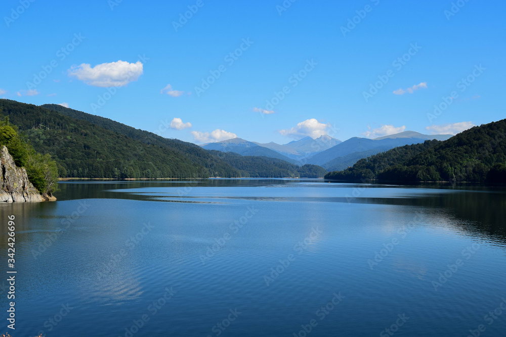 Amazing view to the landscape of Fagaras mountains and Vidraru lake (hydropower construction, waterworks on Transfagarasan highway)