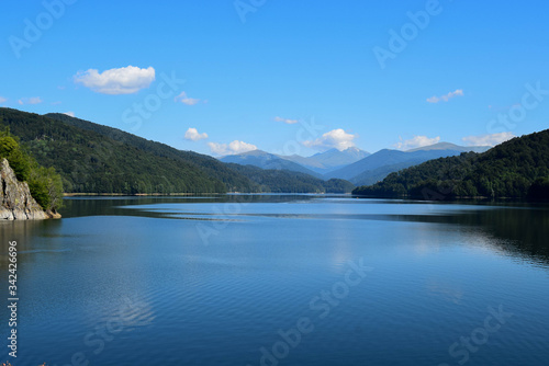 Amazing view to the landscape of Fagaras mountains and Vidraru lake (hydropower construction, waterworks on Transfagarasan highway)