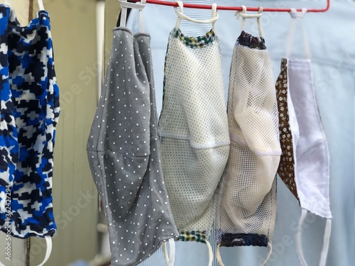 Cotton cloth mask hanging outdoor after the used and washing,natural glare light,the mask repeated use 2-3 times,after use every day should wash and dry in the sun to be sterilized as well,coronavirus