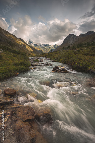 landscape with a river high in the mountains  swiss alps