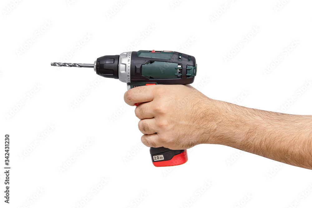 Electric drill in a man's hand on a white background Electric drill in a man's hand on a white background