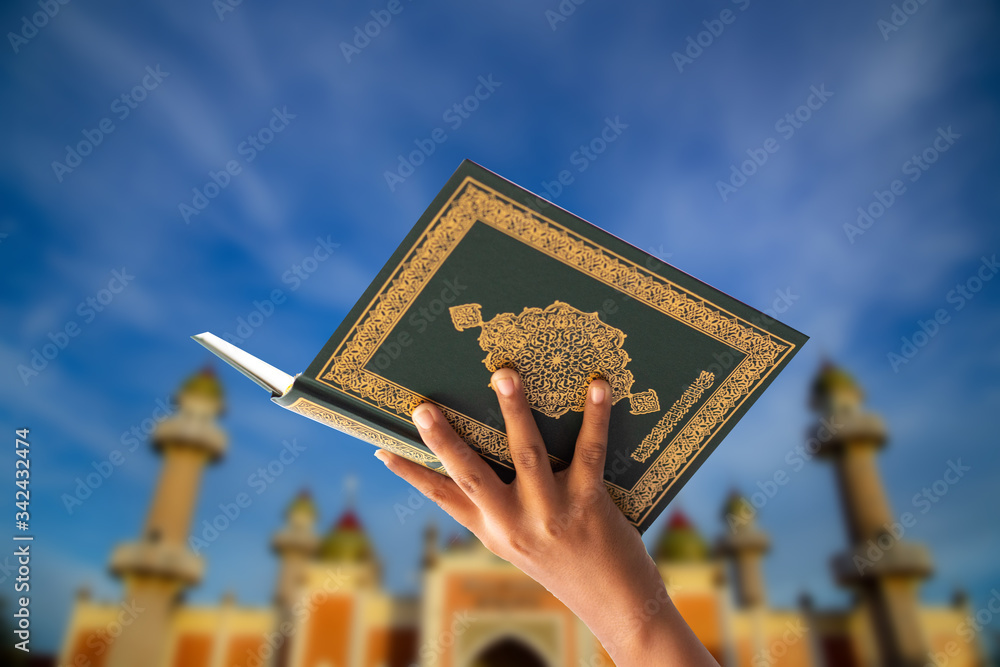 
Quran - holy book of Muslims religion, Concept: open book holy prayers for god,
 Friday In the month of Ramadan  religion Islamic worshiping faith and learn koran and rosary put on wooden  boards  - obrazy, fototapety, plakaty 