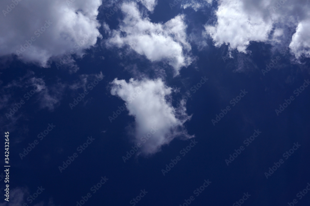 Fototapeta premium Blue sky background with white clouds 