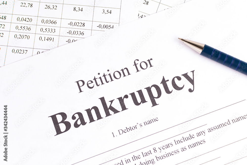 Close-up bancruptcy petition and pen. Application form. Close-up bancruptcy petition and pen. Application form.