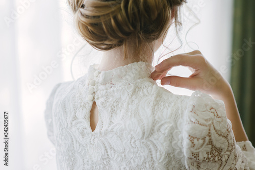 the back of the head of a young girl in a beautiful vintage dress