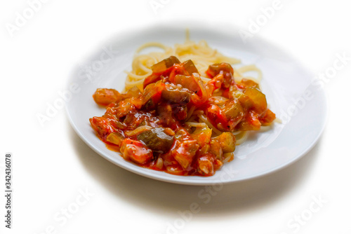 Pasta in a plate on a white background