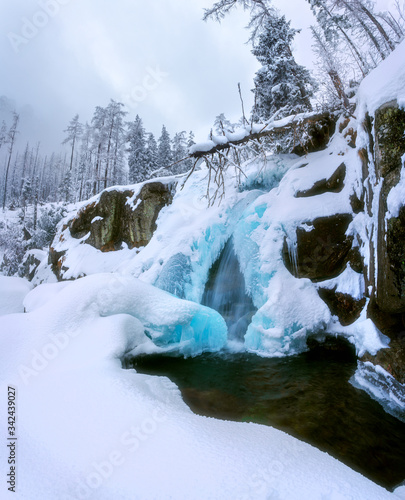 frozen waterfall in the mountains, blue ice, tatras slovakia