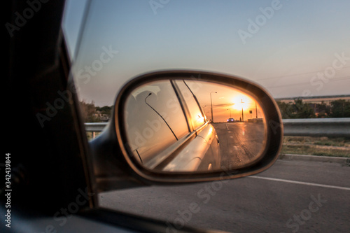 Sunset reflection in the car mirror  © Julia Snow