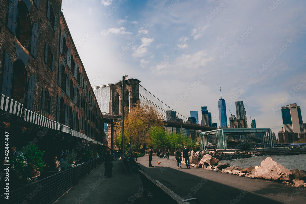 Fototapeta premium New York City, NY, USA - 04/20/2019: Brooklyn Bridge and Empire State building