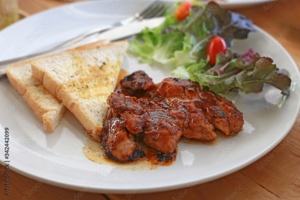 Pork steak set on white plate