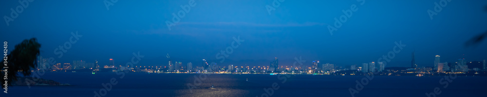 Obraz premium Beautiful nature view of night sea beach on blurred blue with copy space using as background natural landscape, fresh cover page, world oceans day concept.
