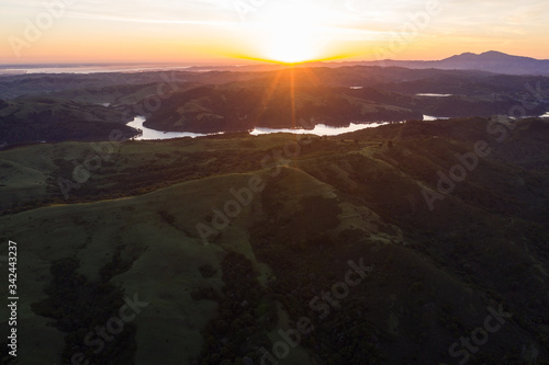 Sunrise greets the tranquil, green hills of the east bay region of Northern California, just east of San Francisco Bay. This beautiful area is green in the winter and spring and golden in the summer.