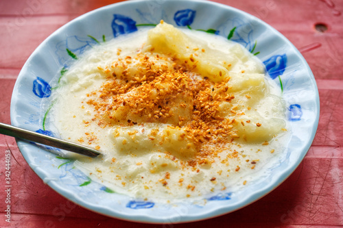 Cooked tapioca and coconut milk ( khoai mi nuoc cot dua ). Vietnamese food photo