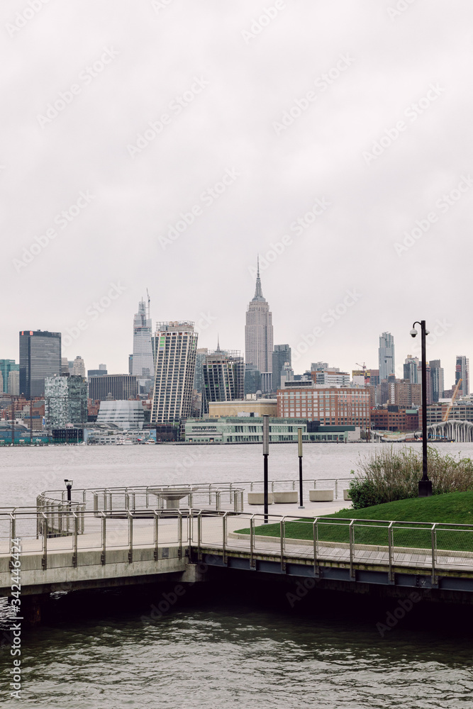 Fototapeta premium April 20 2020 - Hoboken NJ: waterfront pier closed due to the COVID-19 Coronavirus outbreak. The parks are close to increase social distancing and prevent people from getting close