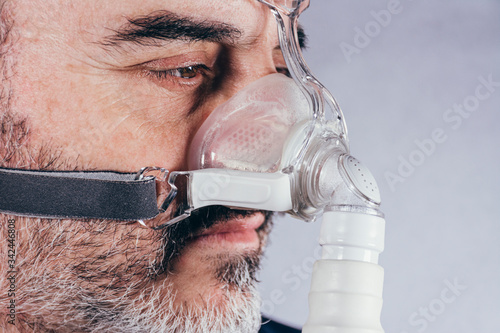 Man with respiratory mask for assisted breathing