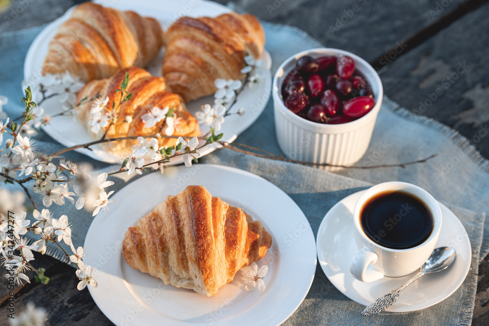 Freshly backed croissants with berries and coffe Freshly backed croissants with berries and coffe