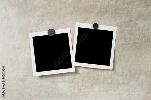 Blank polaroid photo frame with soft shadows and  magnet tape isolated on grey paper background as template for graphic designers presentations, portfolios etc. kids. magnetic board
