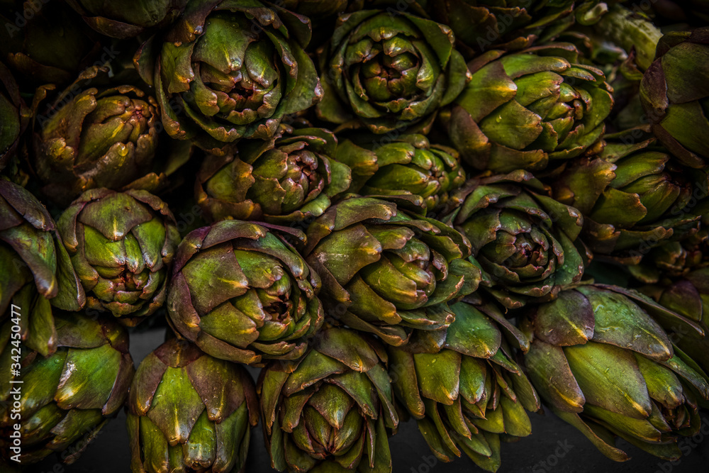 Fototapeta premium Fresh artichokes on a market stall