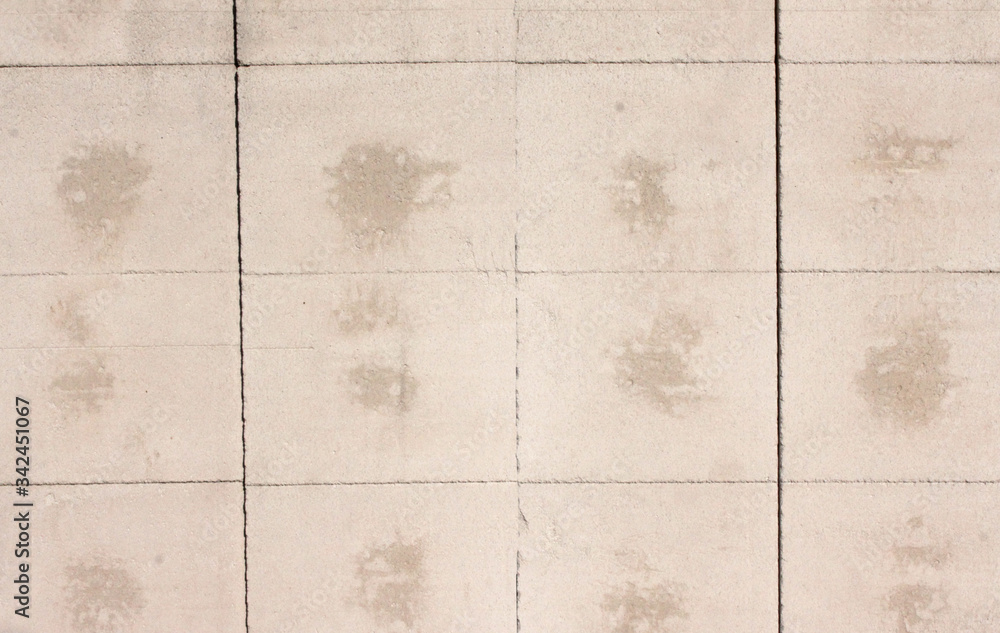 A group of people sitting on a tiled floor A group of people sitting on a tiled floor