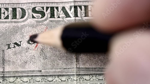 hand replacing the word god for science on on a US dollar bill. Suitable for science research, coronavirus vaccine or science as new relligion concepts.