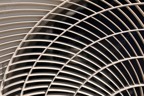 close up of air conditioner texture. Air condition cover texture. Gray protective plastic cover for air conditioner fan. Detail of industrial equipment. Close-up  abstract background  lattice pattern