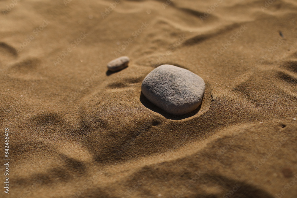 stones on the sand beach background. natural wallpaper, texture. selective focus. cope space stones on the sand beach background. natural wallpaper, texture. selective focus. cope space
