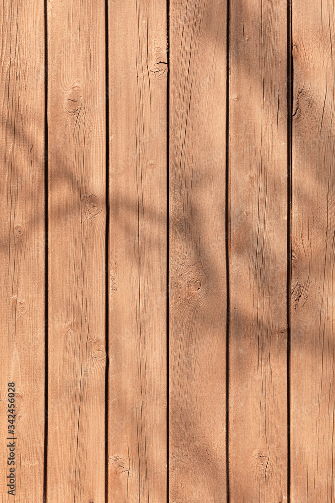 Naklejka premium Backgroud of aged natural old wood fence wall texture. Top view. Vertical orientation