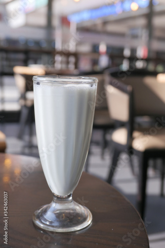 Close up of milk shake on cafe table.