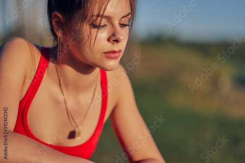 close-up portrait of a young woman athlete in nature