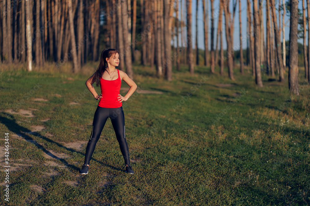 Morning exercise of a sports girl on nature Morning exercise of a sports girl on nature