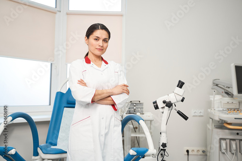 Young attractive medical worker looking at camera